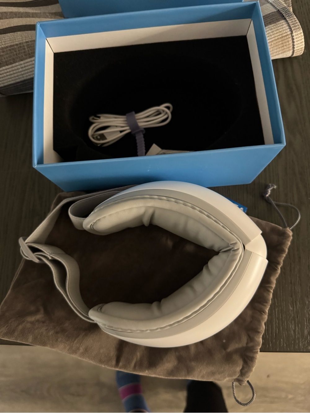 White Over-Ear eye  massager with Carry Pouch